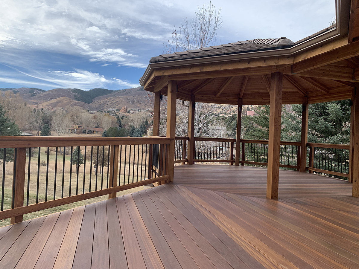 beautiful mahogany deck leading out to a gazebo
